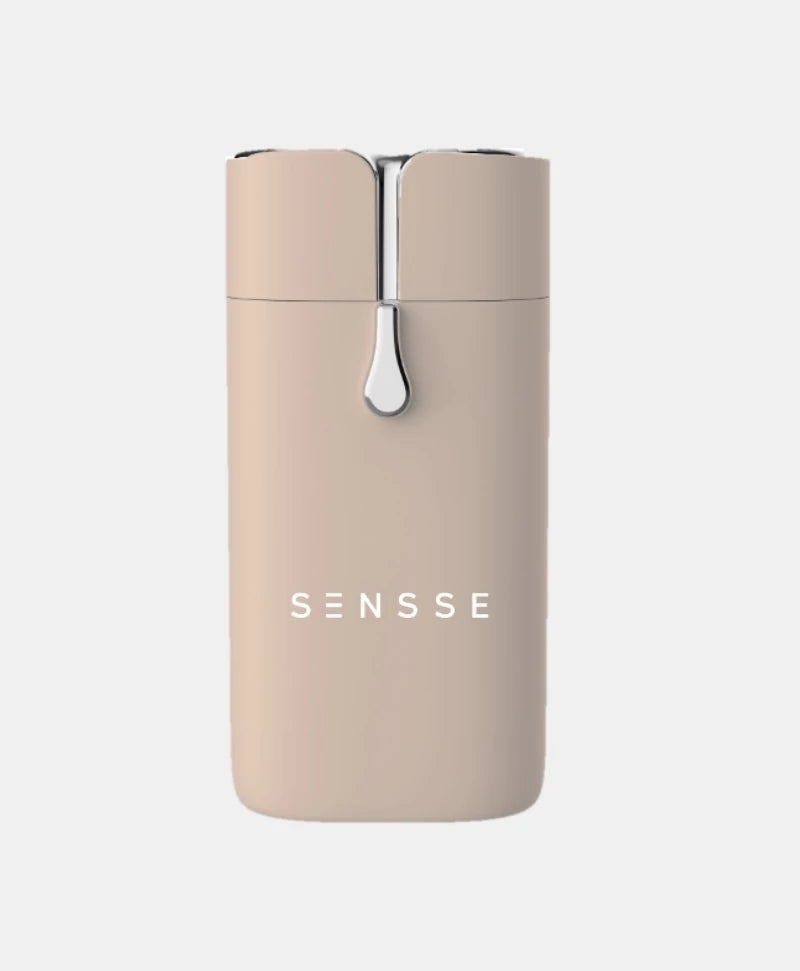 A nude colour hair removal tool with metallic detail.
