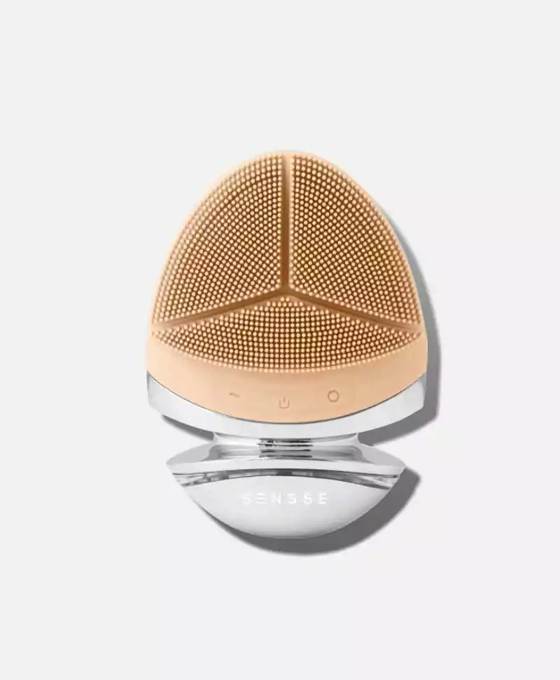 A nude, silicone facial cleansing tool.